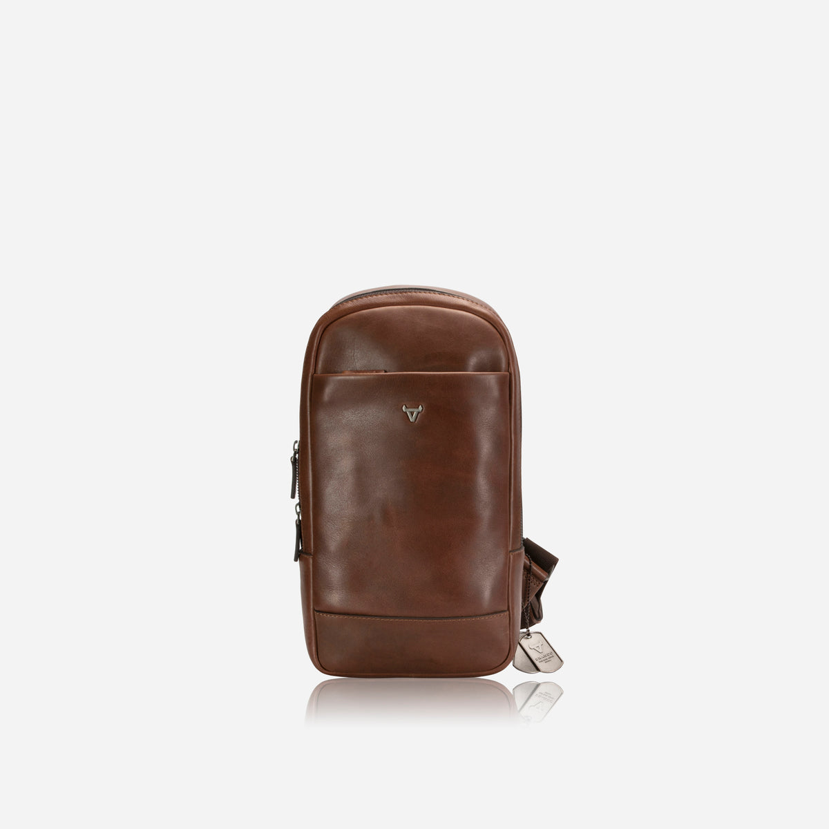 Brando Brosnan One Strap Backpack in brown, front view with zip pocket and logo