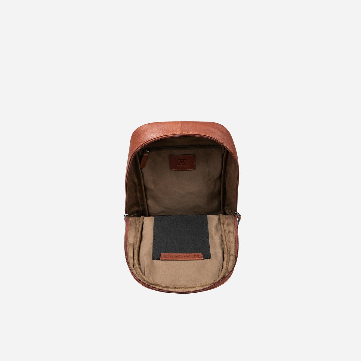 Copper Kudu one strap backpack opened flat, showing taupe lining, inner zip pocket and slip pouch
