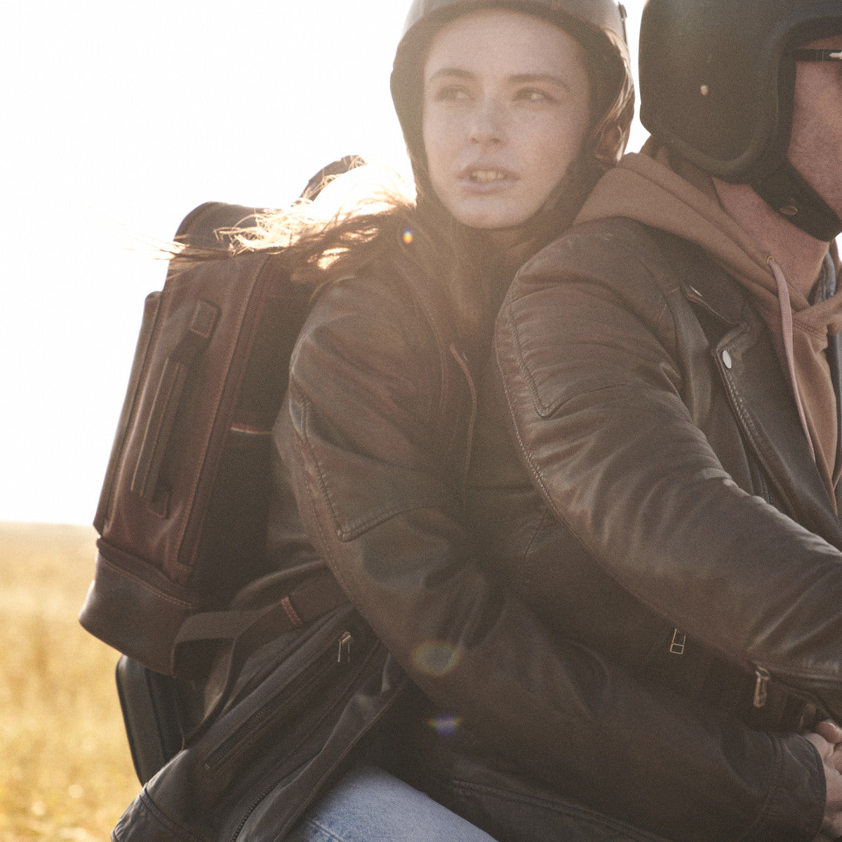 Brown James Laptop Backpack worn by a woman riding pillion on a motorbike